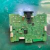 Disassembled PS5 controller circuit board on green mat at Tech Lab